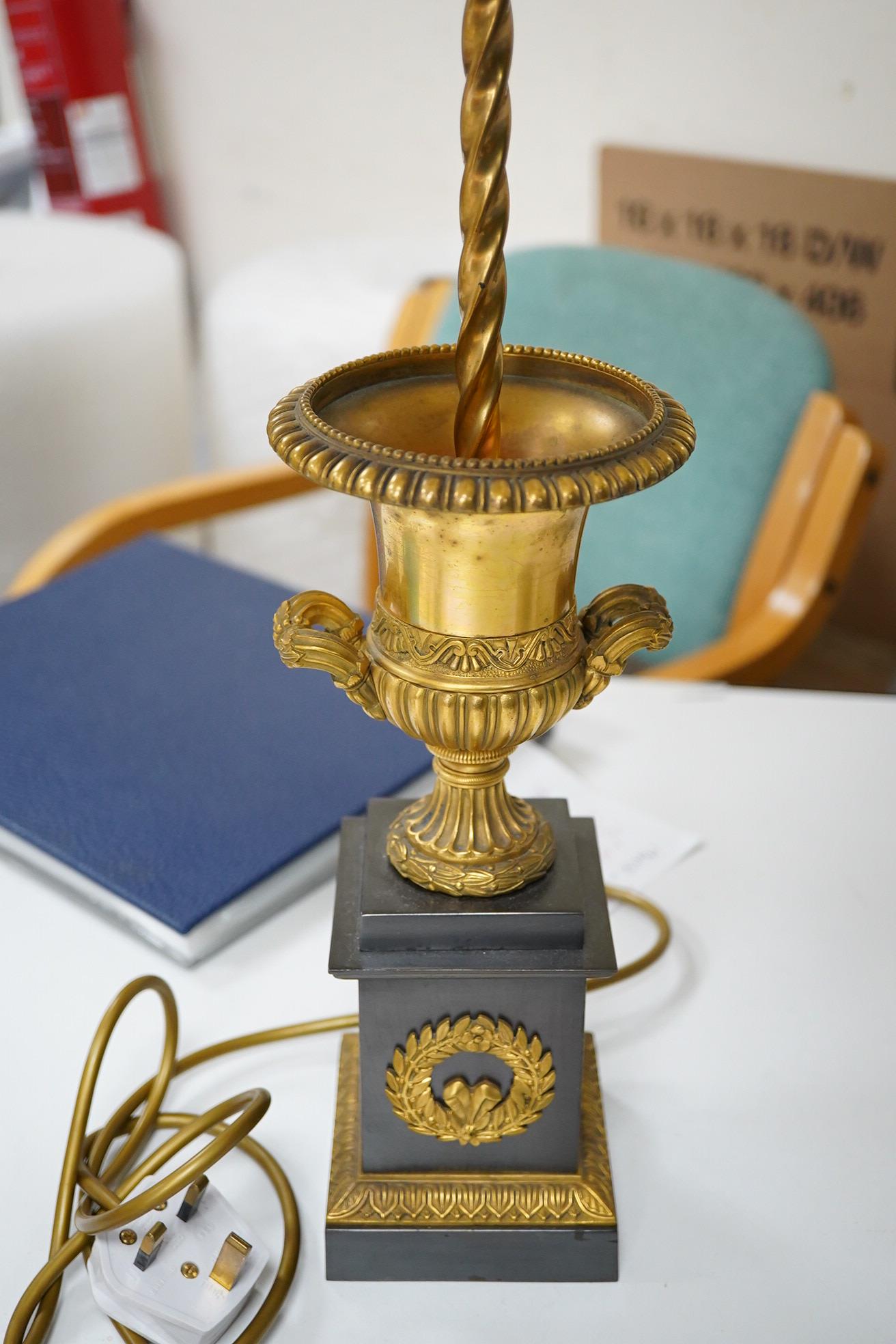 A pair of Empire style lamps with green shades